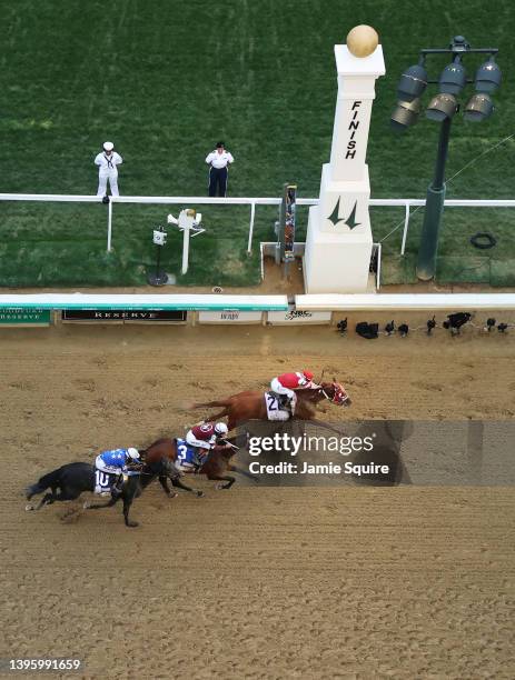 Rich Strike with Sonny Leon up crosses the finish line to win ahead of Epicenter and Zandon during the 148th running of the Kentucky Derby at...