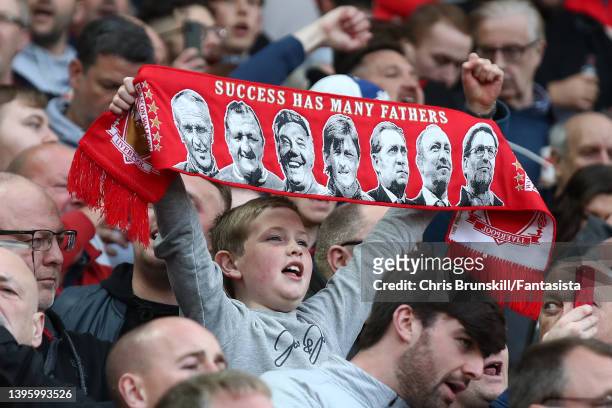 Liverpool fan supports his team on The Kop during the Premier League match between Liverpool and Tottenham Hotspur at Anfield on May 07, 2022 in...