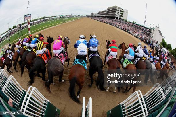 The field leaves the starting gate to begin the 148th running of the Kentucky Derby at Churchill Downs on May 07, 2022 in Louisville, Kentucky. Rich...