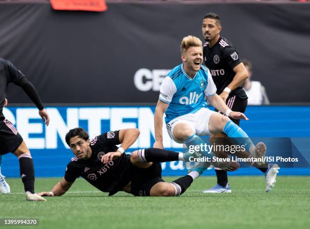 Kamil Jozwiak of Charlotte FC grimaces after a tackle by Leonardo Campana of Inter Miami FC during a game between Inter Miami CF and Charlotte FC at...