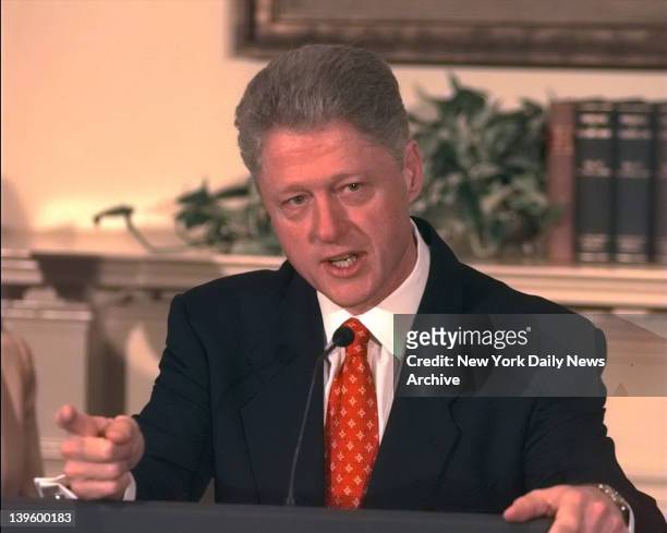President Bill Clinton shakes his finger as he denies improper behavior with Monica Lewinsky, in the White House Roosevelt Room. "I did not have...