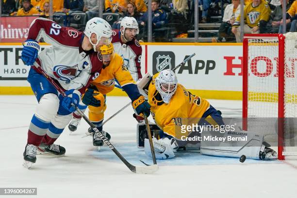 Gabriel Landeskog of the Colorado Avalanche goes for the rebound as Connor Ingram of the Nashville Predators makes a pad save during the second...