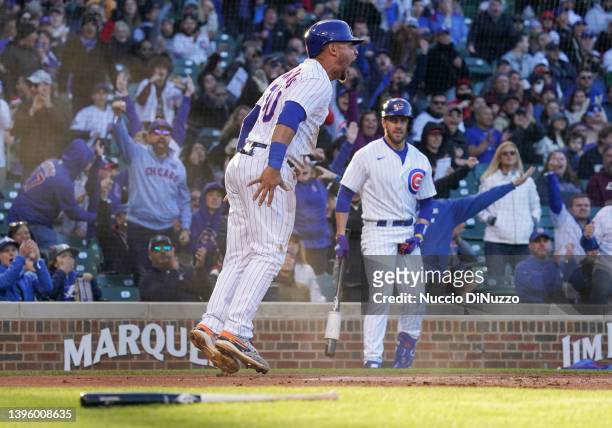 Willson Contreras of the Chicago Cubs reacts after scoring during the first inning of Game Two of a doubleheader at Wrigley Field on May 07, 2022 in...