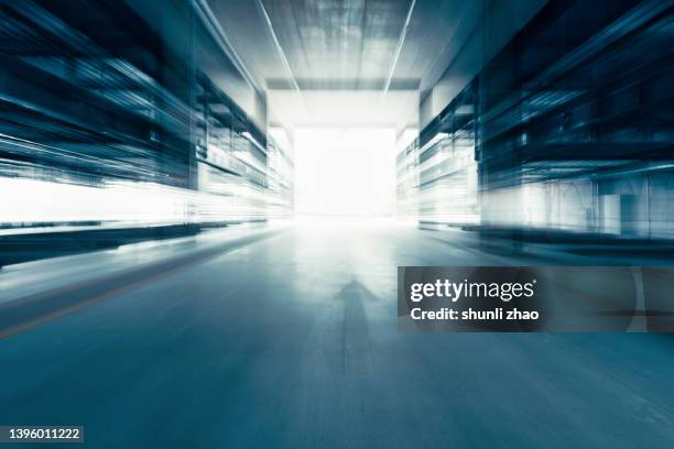 driving in tunnel - illuminated corridor stock pictures, royalty-free photos & images