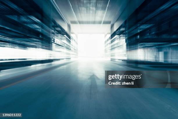 driving in tunnel - illuminated corridor stock pictures, royalty-free photos & images