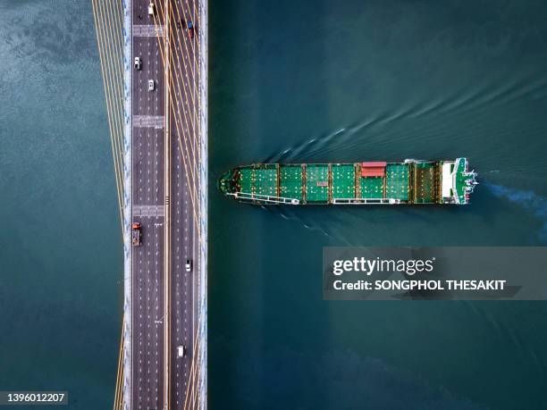 aerial view/a ship that sails at sea to transport goods to the destination country. - boat engine stock pictures, royalty-free photos & images