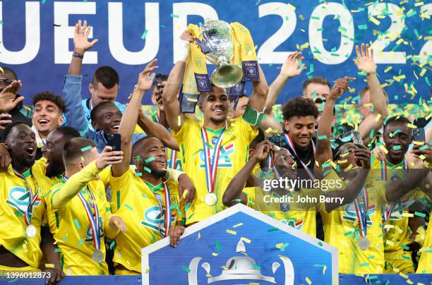 Captain Ludovic Blas of Nantes and teammates celebrate winning during the trophy ceremony following the French Cup Final between OGC Nice and FC...