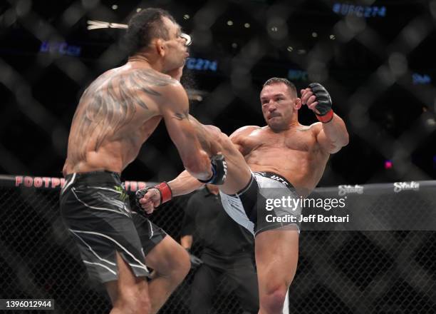 Michael Chandler knocks out Tony Ferguson in a lightweight fight during the UFC 274 event at Footprint Center on May 07, 2022 in Phoenix, Arizona.