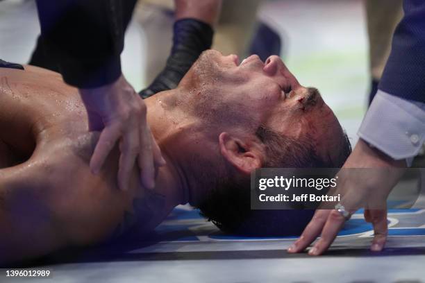 Tony Ferguson is treated after his knockout loss to Michael Chandler in a lightweight fight during the UFC 274 event at Footprint Center on May 07,...