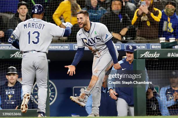 Manuel Margot of the Tampa Bay Rays celebrates his grand slam with Kevin Kiermaier during the eighth inning against the Seattle Mariners at T-Mobile...