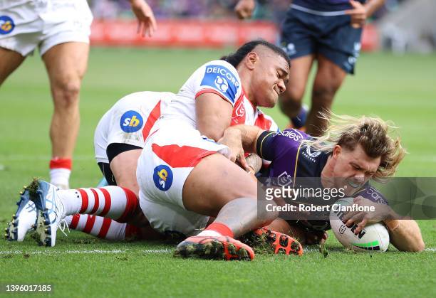 Ryan Papenhuyzen of the Storm scores a try during the round nine NRL match between the Melbourne Storm and the St George Illawarra Dragons at AAMI...