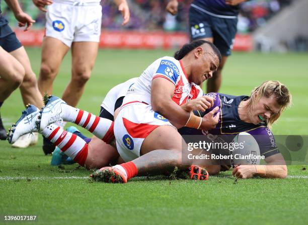 Ryan Papenhuyzen of the Storm scores a try during the round nine NRL match between the Melbourne Storm and the St George Illawarra Dragons at AAMI...