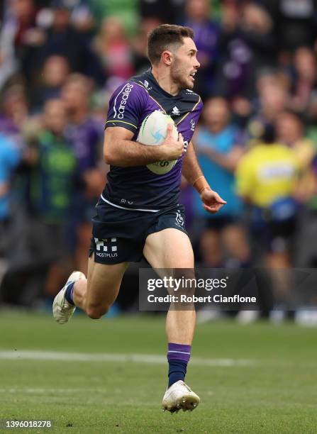 Nick Meaney of the Storm makes a break on ho\is way to scoring a try during the round nine NRL match between the Melbourne Storm and the St George...