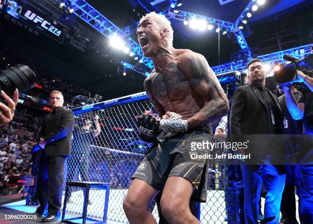 Charles Oliveira of Brazil reacts after his submission victory over Justin Gaethje in the UFC lightweight championship fight during the UFC 274 event...