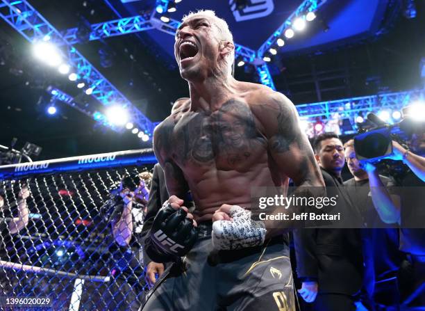 Charles Oliveira of Brazil reacts after his submission victory over Justin Gaethje in the UFC lightweight championship fight during the UFC 274 event...