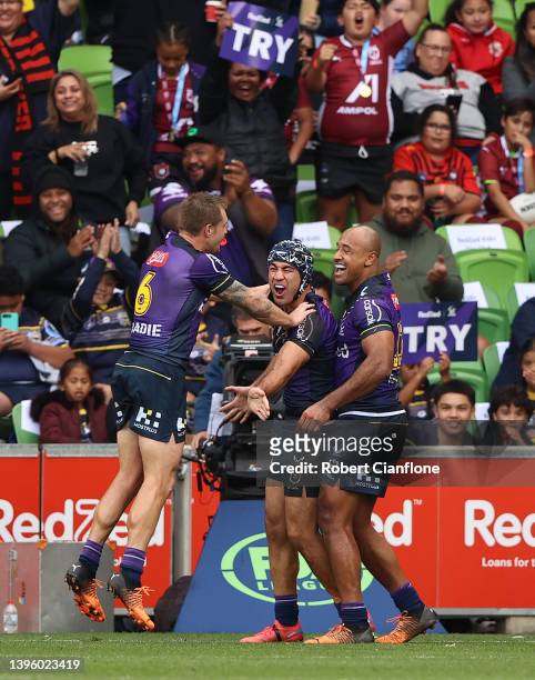 Jahrome Hughes of the Storm celebrates after scoring a try during the round nine NRL match between the Melbourne Storm and the St George Illawarra...