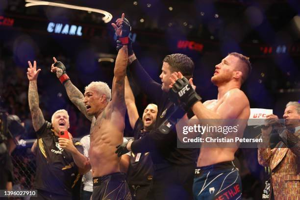 Charles Oliveira of Brazil celebrates after his submission victory over Justin Gaethje in their UFC lightweight championship bout during UFC 274 at...