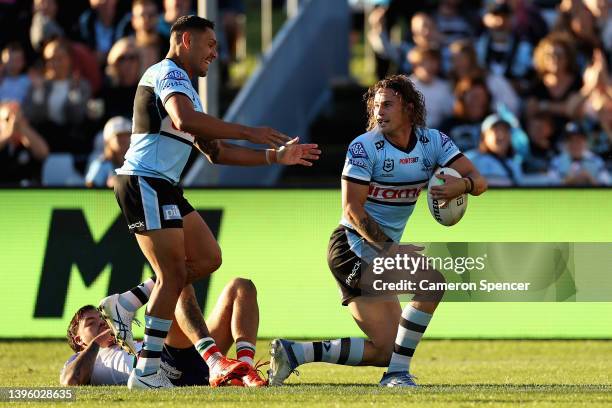 Nicholas Hynes of the Sharks celebrates scoring a try during the round nine NRL match between the Cronulla Sharks and the New Zealand Warriors at...