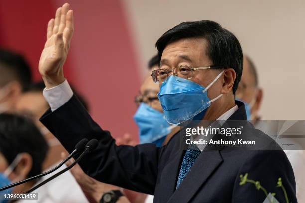 Hong Kong Chief Executive-elect John Lee Ka-chiu waves during a press conference after being elected at the Exhibition and Convention Centre on May...