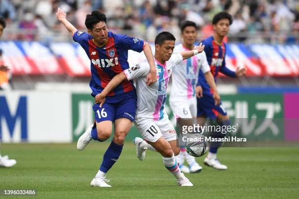 Yuji Ono of Sagan Tosu and Takuya Aoki of FC Tokyo compete for the ball prior to the J.LEAGUE Meiji Yasuda J1 12th Sec. Match between F.C.Tokyo and...