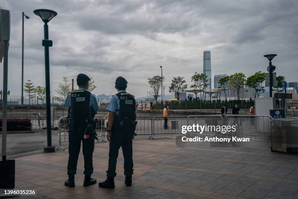 Police officers stand guard outside the Exhibition and Convention Centre ahead of the Chief Executive Election on May 08, 2022 in Hong Kong, China....