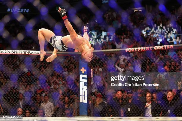 Michael Chandler celebrates after his knockout victory over Tony Ferguson in their men’s lightweight bout during UFC 274 at Footprint Center on May...