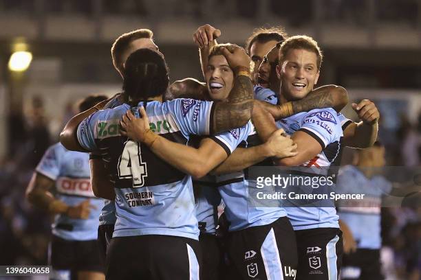 Connor Tracey of the Sharks celebrates scoring a try with team mates during the round nine NRL match between the Cronulla Sharks and the New Zealand...