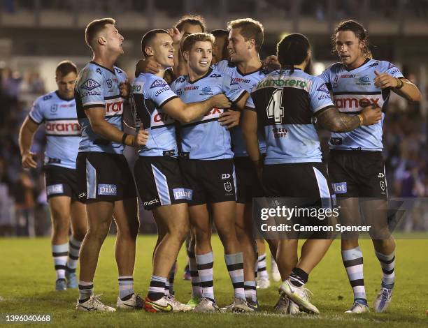 Connor Tracey of the Sharks celebrates scoring a try with team mates during the round nine NRL match between the Cronulla Sharks and the New Zealand...