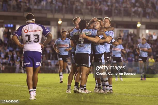 Connor Tracey of the Sharks celebrates scoring a try with team mates during the round nine NRL match between the Cronulla Sharks and the New Zealand...