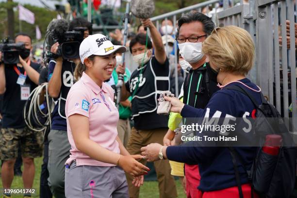 Miyuu Yamashita of Japan is congratulated by her parents after winning the tournament following the final round of World Ladies Championship Salonpas...