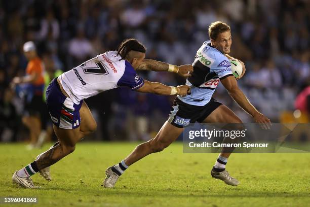 Matt Moylan of the Sharks is tackled during the round nine NRL match between the Cronulla Sharks and the New Zealand Warriors at PointsBet Stadium,...