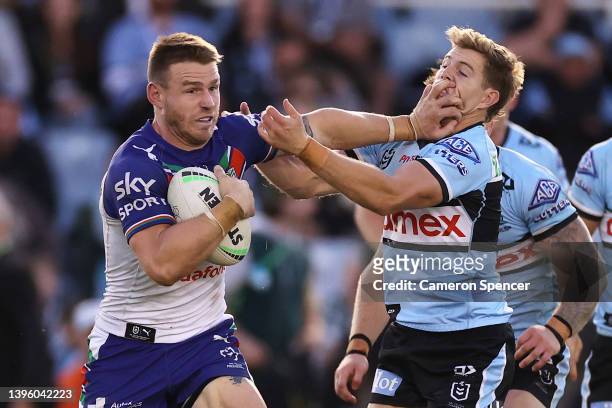 Euan Aitken of the Warriors is tack during the round nine NRL match between the Cronulla Sharks and the New Zealand Warriors at PointsBet Stadium, on...