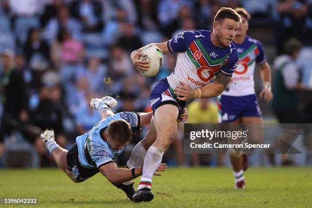 Euan Aitken of the Warriors is tack during the round nine NRL match between the Cronulla Sharks and the New Zealand Warriors at PointsBet Stadium, on...