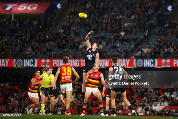Jacob Weitering of the Blues and Taylor Walker of the Crows contest the ruck during the round eight AFL match between the Carlton Blues and the...