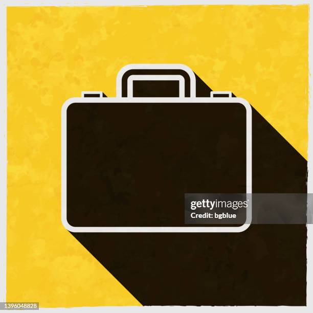 briefcase. icon with long shadow on textured yellow background - leather texture background stock illustrations