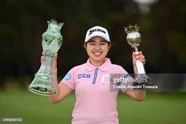 Miyuu Yamashita of Japan poses with the trophies after winning the tournament following the final round of World Ladies Championship Salonpas Cup at...