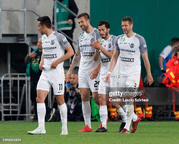 Marko Futacs of MTK Budapest celebrates after scoring a goal with Bojan Miovski of MTK Budapest , Stefan Spirovski of MTK Budapest and Slobodan...