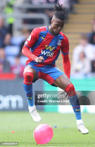 Wilfried Zaha of Crystal Palace controls the ball obscured by a balloon during the Premier League match between Crystal Palace and Watford at...