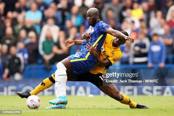 Romelu Lukaku of Chelsea is challenged by Willy Boly of Wolverhampton Wanderers during the Premier League match between Chelsea and Wolverhampton...