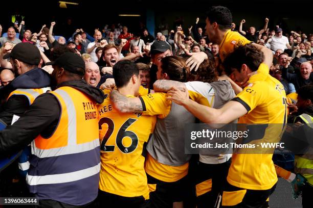 Wolves celebrate their team's second goal scored by Conor Coady of Wolverhampton Wanderers during the Premier League match between Chelsea and...