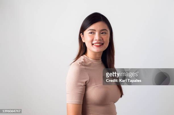 portrait of southeast asian woman on a white background - filipino ethnicity and female not male fotografías e imágenes de stock