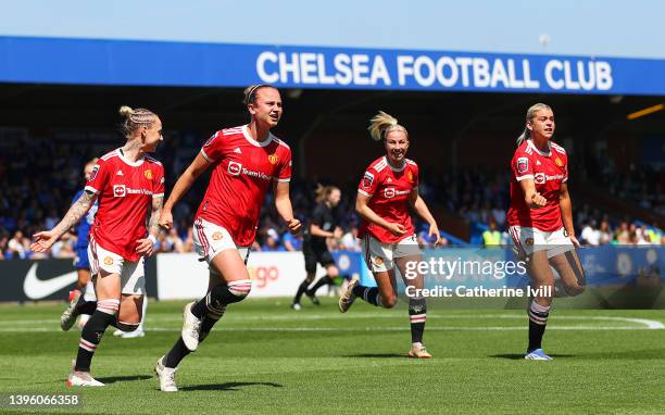 Martha Thomas of Manchester United celebrates with teammates after scoring their team's first goal during the Barclays FA Women's Super League match...