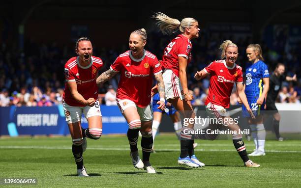 Martha Thomas celebrates with Ona Batlle of Manchester United after scoring their team's first goal during the Barclays FA Women's Super League match...