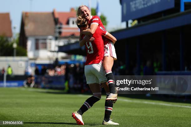 Martha Thomas celebrates with Jackie Groenen of Manchester United after scoring their team's first goal during the Barclays FA Women's Super League...