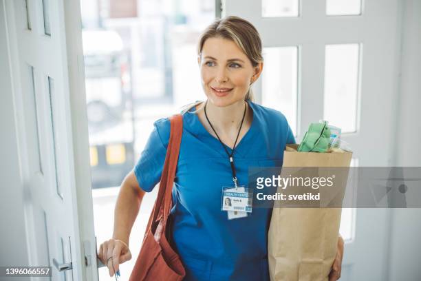 female doctor coming home - returning home after work stock pictures, royalty-free photos & images