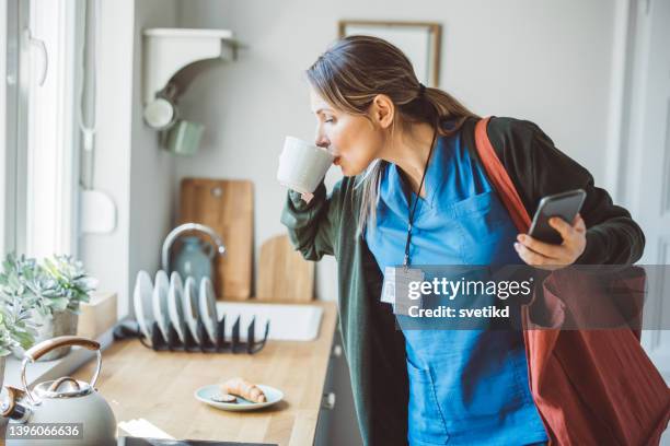 female doctor at home - morning tea stock pictures, royalty-free photos & images