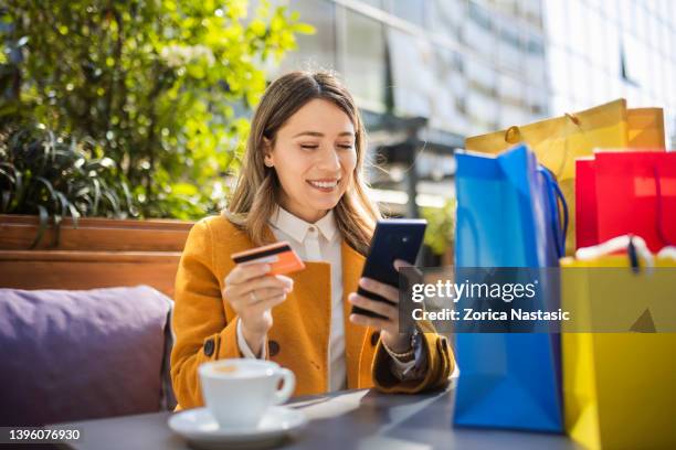 online shopping on a shopping brake - online retail stock pictures, royalty-free photos & images