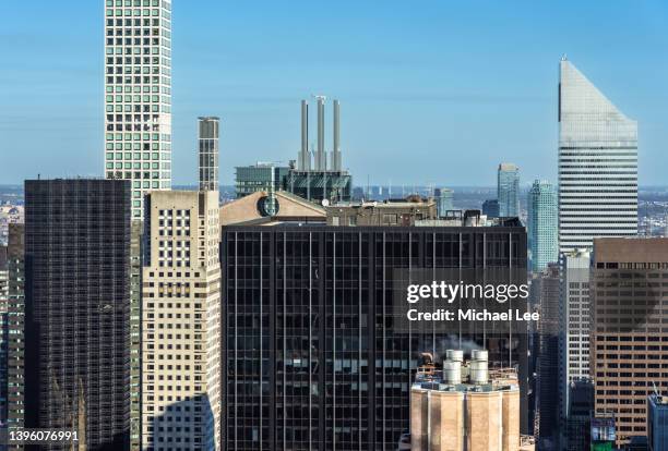 sunny high angle view of midtown manhattan towers - midtown manhattan ストックフォトと画像