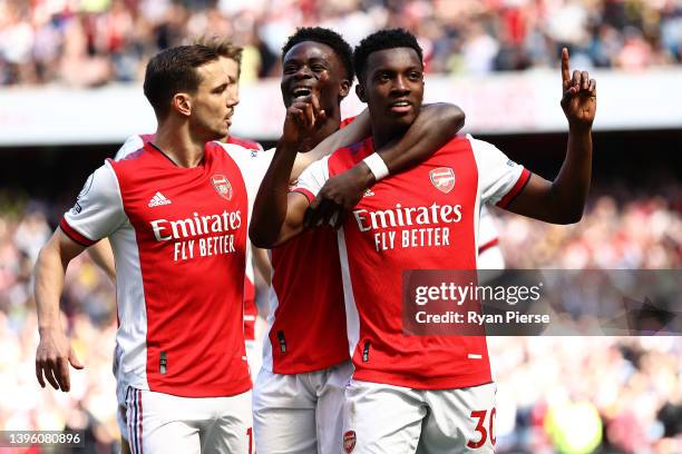 Eddie Nketiah of Arsenal celebrates scoring their side's first goal with teammates during the Premier League match between Arsenal and Leeds United...
