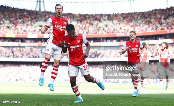 Eddie Nketiah of Arsenal celebrates scoring their side's second goal with teammate Cedric Soares during the Premier League match between Arsenal and...